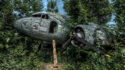 Abandoned Aircraft Wreck In The Forest Backiee