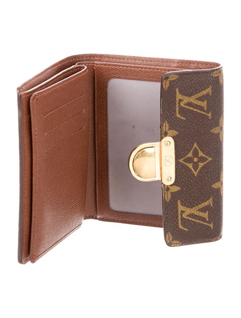 We authenticated it to be fake, and we also believe this item is a fake version below you can find how this fake louis vuitton piece compares to that of the original lv sarah etoile. Louis Vuitton Monogram Koala Wallet - Accessories ...
