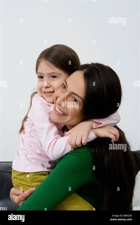 A Mother And Her Small Daughter Embracing Stock Photo Alamy