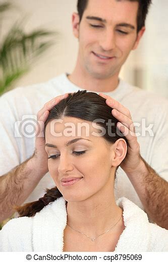Man Giving His Wife A Head Massage Canstock
