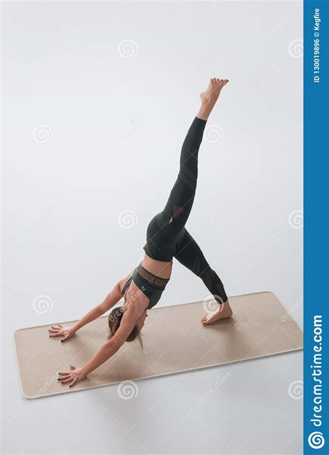 Woman Practicing Yoga Asana On Mat Stock Photo Image Of Shape