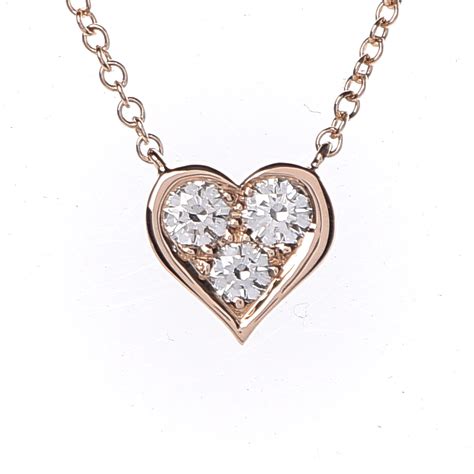 This stunning diamond pendant has been set with 7 diamonds totaling 0.18 carats in weight and is made from 18k rose gold. TIFFANY 18K Rose Gold Diamond Heart Pendant Necklace 400411