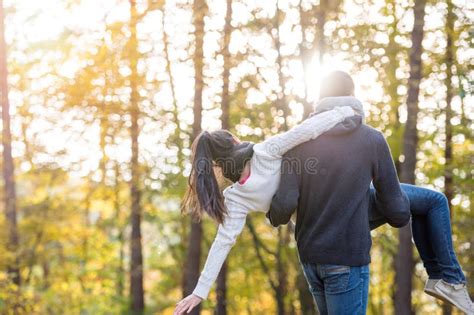 Couple In Love Man Carrying Woman In His Arms Stock Photo Image Of