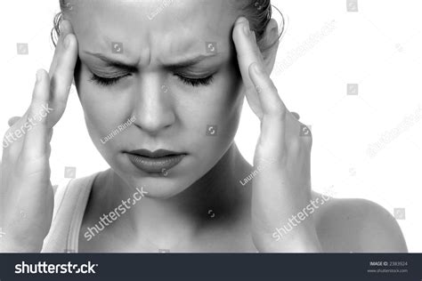Woman With Severe Migraine Headache Holding Hands To Head Stock Photo
