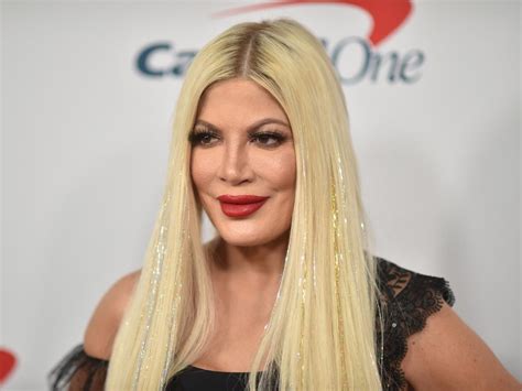 tori spelling s daughter told her to get new breast implants because she was ‘concerned