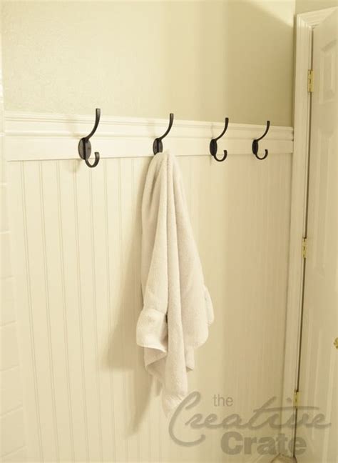 On the opposite side of the vanity, a unique hexagon shelving this towel display idea allows you to avoid putting holes in walls with towel rings and bars. Towel bars, Towels and Hooks on Pinterest