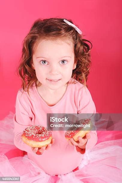 Cute Baby Girl Eating Donuts In Studio Stock Photo Download Image Now