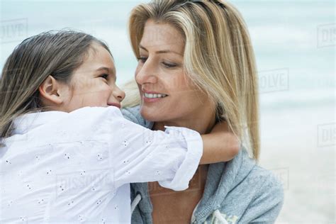 Mother And Daughter Looking At Each Other Portrait Stock Photo