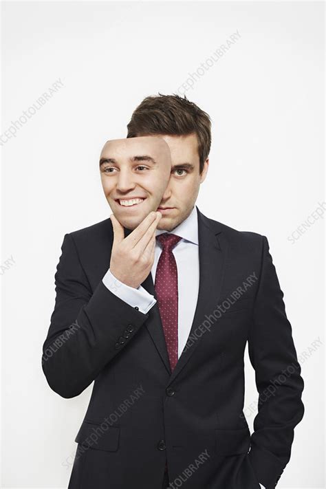 Businessman Holding Mask Over His Face Stock Image F0078652 Science Photo Library