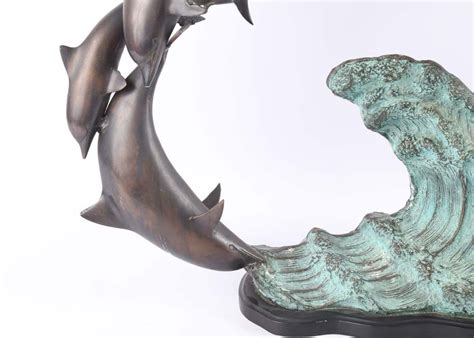 Aged Brass Leaping Dolphins Sculpture Ebth