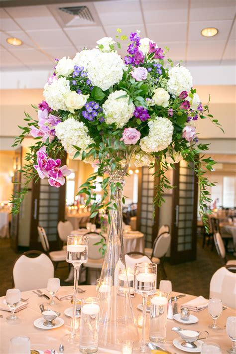 Purple Rose And White Hydrangea Centerpiece In Tall Glass White