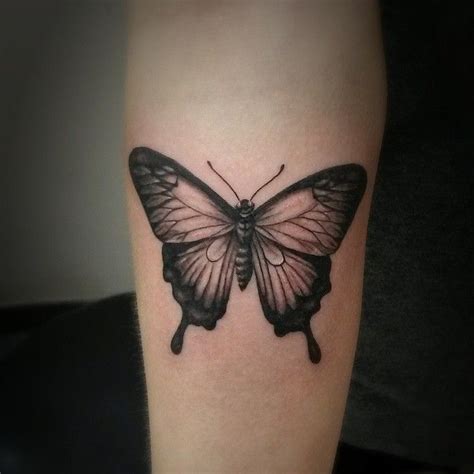 White butterfly tattoos are very much feminine and look striking on dark skin tone. Butterfly Tattoo Sasha Roussel Black Gold Tattoo Co ...
