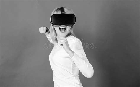 Portrait Of Young Woman Wearing Vr Goggles Experiencing Virtual Reality Using 3d Headset