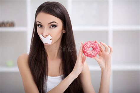 Diet Close Up Face Of Young Beautiful Sad Latin Woman With Mouth