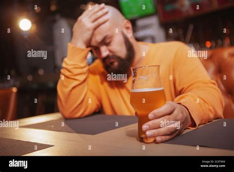 Sad Man Drinking Alone At The Beer Pub Depressed Man Having Beer At