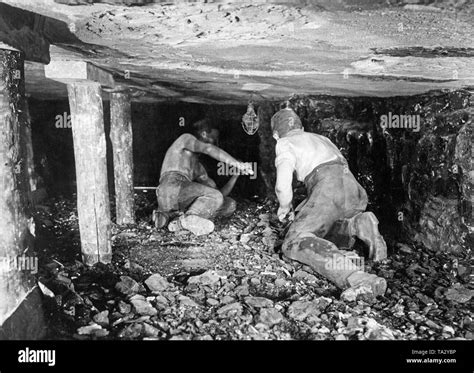 Look Into A Tunnel 1934 Two Miners Are Mining Coal Stock Photo Alamy