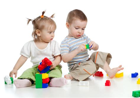 Little Children Playing Together With Colorful Toy Stock Photos Image