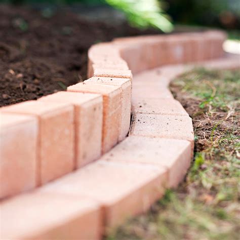 Garden borders provide infinite opportunities for imaginative planting and are central to a successful garden design. Curved Brick Garden Border | Better Homes & Gardens