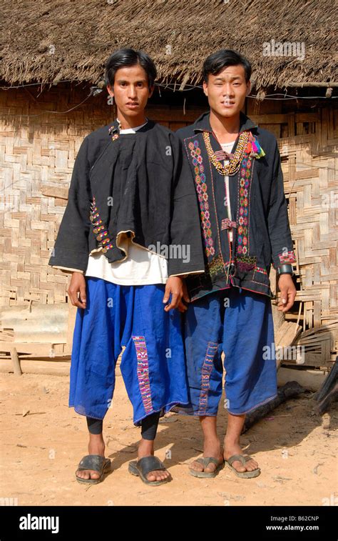 Two Men Of The Akha Lom Tribe Both Wearing Traditional Dress Ban Noy Phongsali Province Laos