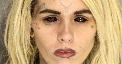 Haunting Mugshot Of Mum With Tattooed Eyes And Inked Face After