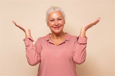 Smile Senior Woman Holding Something On Open Palms Stock Image Image