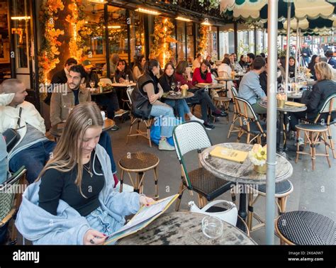 People Sitting Outside At A Cafe In Paris France Stock Photo Alamy