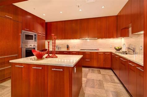 Cherry kitchen cabinets are a favorite because of their warm tones and rich look. Cherry Kitchen Cabinets With Gray Wall And Quartz ...