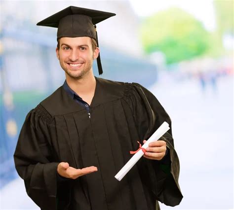 Young Graduation Man Holding Certificate — Stock Photo © Coolfonk 18779137