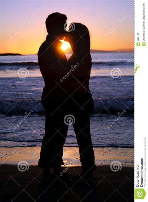 Silhouette Of A Young Couple Kissing At The Beach Stock Image Image