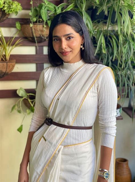 Aishwarya Lekshmi Dresses To Impress In An Off White Saree With Belt