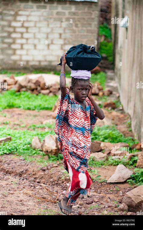 Mali Africa Black Young Girl Carrying Food On Her Head Bamako Town Urban Scene Stock Photo