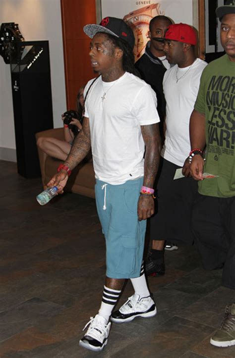 A white midsole, red translucent outsole, and jordan branding on the tongue complete the design. Celebrity Feet: Lil' Wayne - Air Jordan XI 'Concord ...