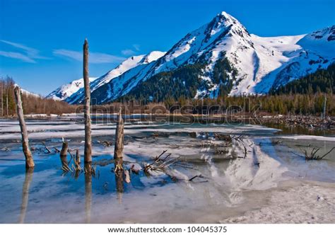 Partially Frozen Lake Mountain Range Reflected Stock Photo 104045375