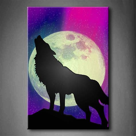 A Wolf Standing On Top Of A Hill In Front Of A Full Moon