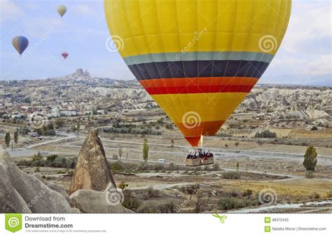 Colorful Hot Air Balloon Flying Over The Valley At Cappadocia Stock