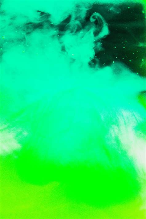 Download A Vibrant Blend Of Yellow And Green Smoke Wallpaper