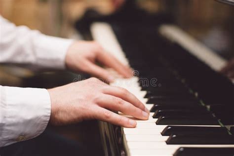 Close Up Of A Music Performer S Hand Playing The Piano Stock Photo