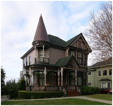 An Old Victorian Style House With A Turret