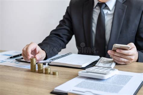 Businessman Accountant Counting Money And Making Notes At Report Doing