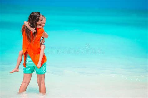 Beautiful Mother And Daughter At Caribbean Beach Enjoying Summer Vacation Stock Image Image