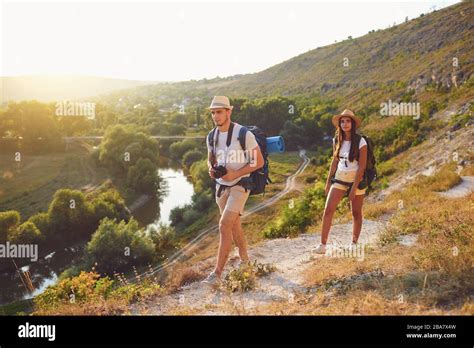 Couple Hikers With Backpack On Hike In Nature Stock Photo Alamy