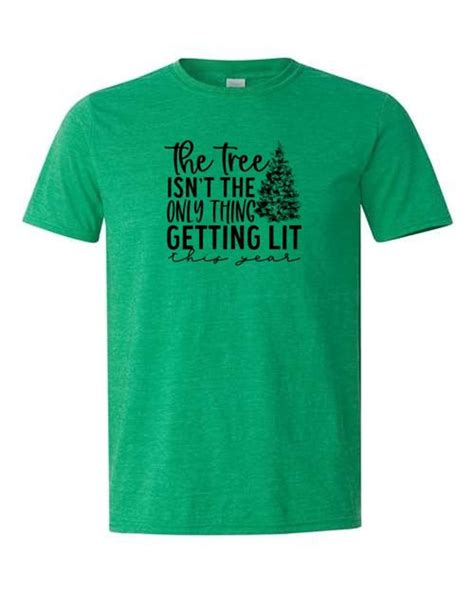the tree isnt the only thing getting lit this year sublimated shirt softstyle christmas santa