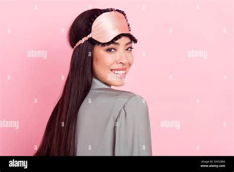 profile side view portrait of attractive cheerful girl wearing silky blindfold posing isolated