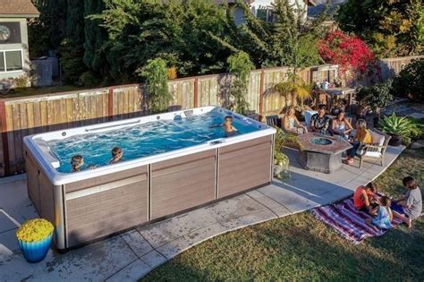 Get The Ultimate Backyard Retreat With A Rectangle Pool With Jacuzzi