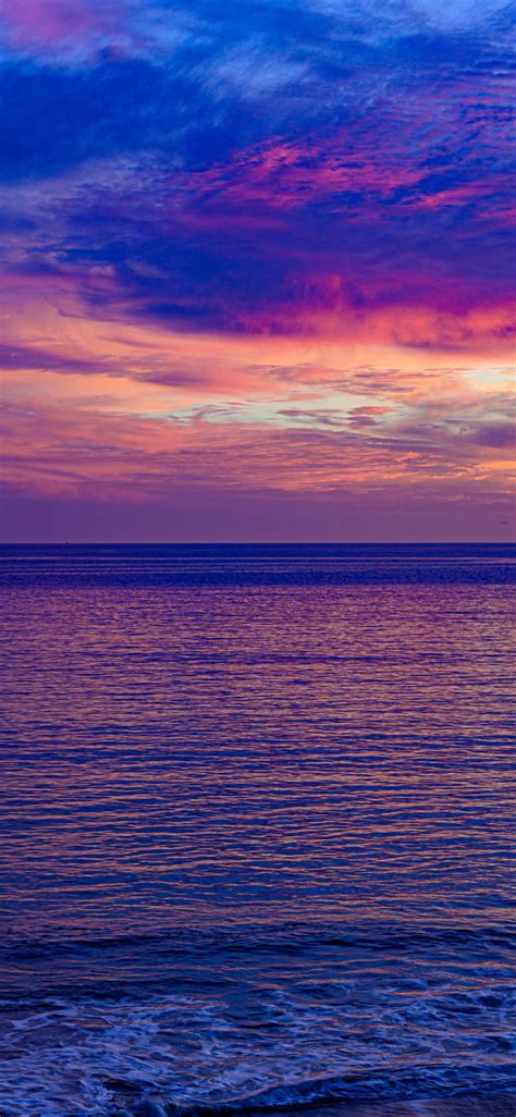 Download 1125x2436 Wallpaper Pink Sunset Seascape Calm And Beautiful