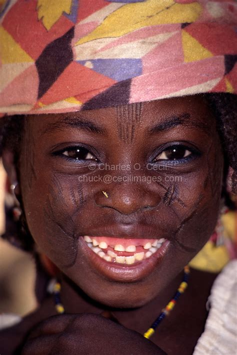 West African Portrait Of Ethnic Hausa Girl With Facial Scarification