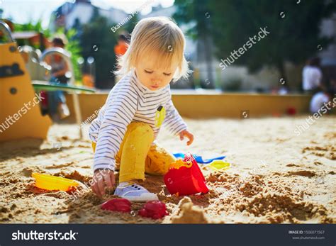 Adorable Little Girl On Playground Sandpit Stock Photo Edit Now