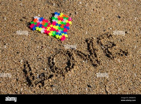 Puzzle love on the shore: Vibrant heart emerges from sandy devotion, a