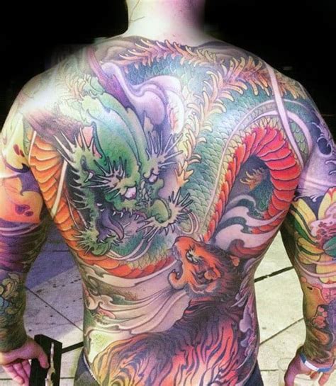 Men are very creative when it comes to the moment to choose the part of the body they would like to put tattoos on. 40 Tiger Dragon Tattoo Designs For Men - Manly Ink Ideas