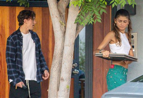 zendaya and tom holland are back on as spider man couple caught kissing in shocking new photos two